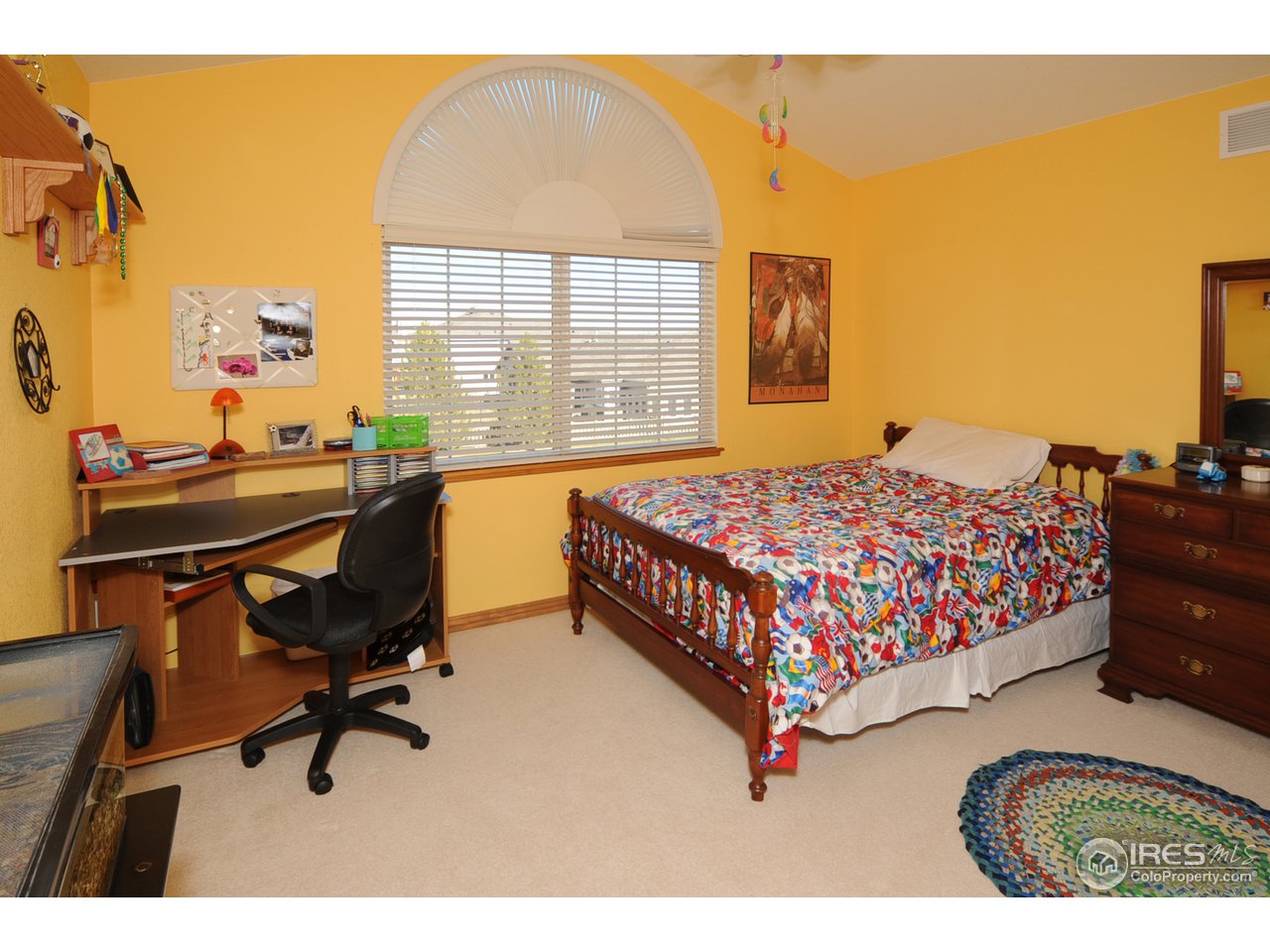 3147 Rookery Road Fort Collins, CO 80528 - Photo 14 of 18 a bedroom with a bed chair and a desk in it
