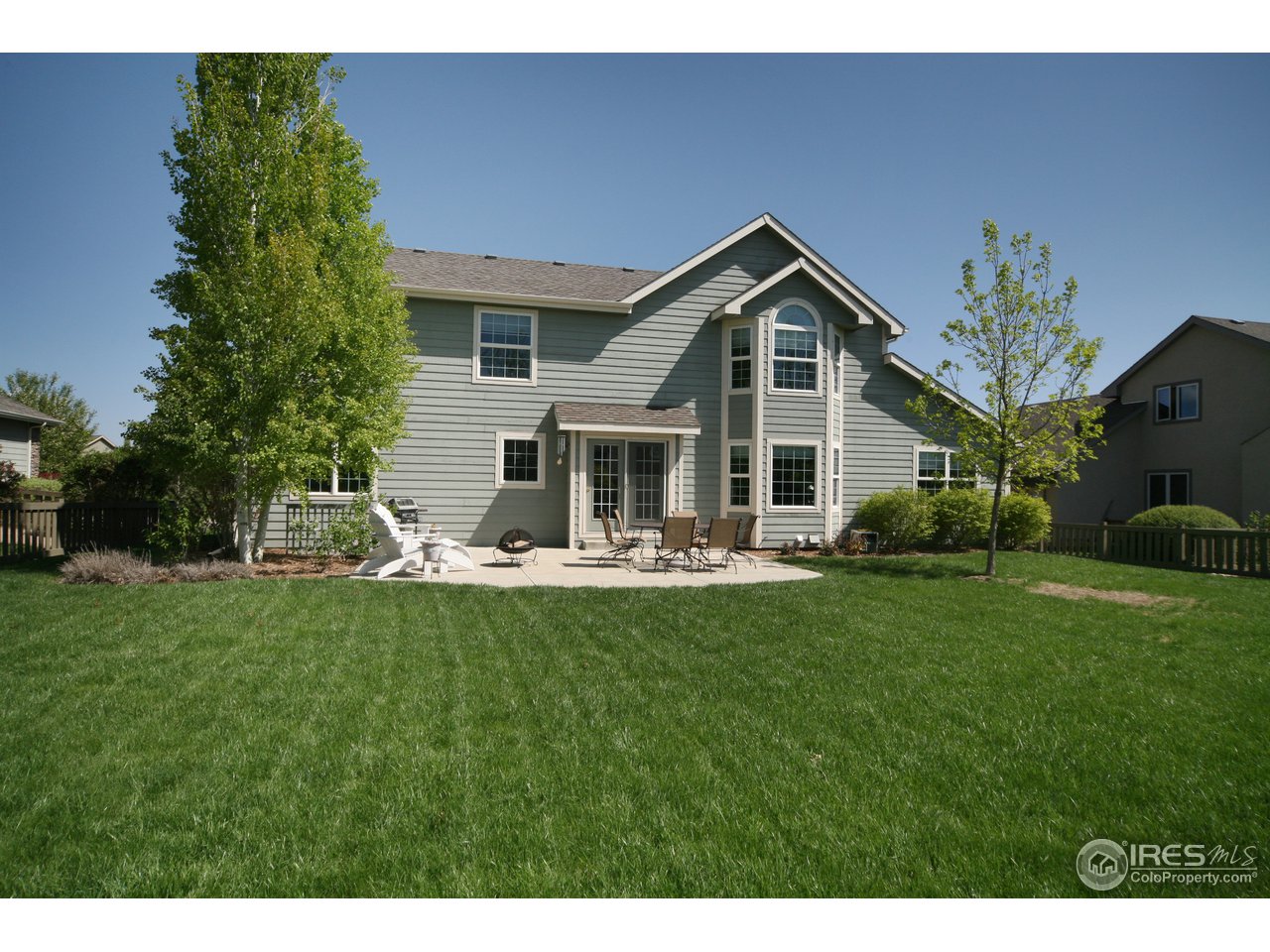 3147 Rookery Road Fort Collins, CO 80528 - Photo 18 of 18 a front view of house with backyard and green space