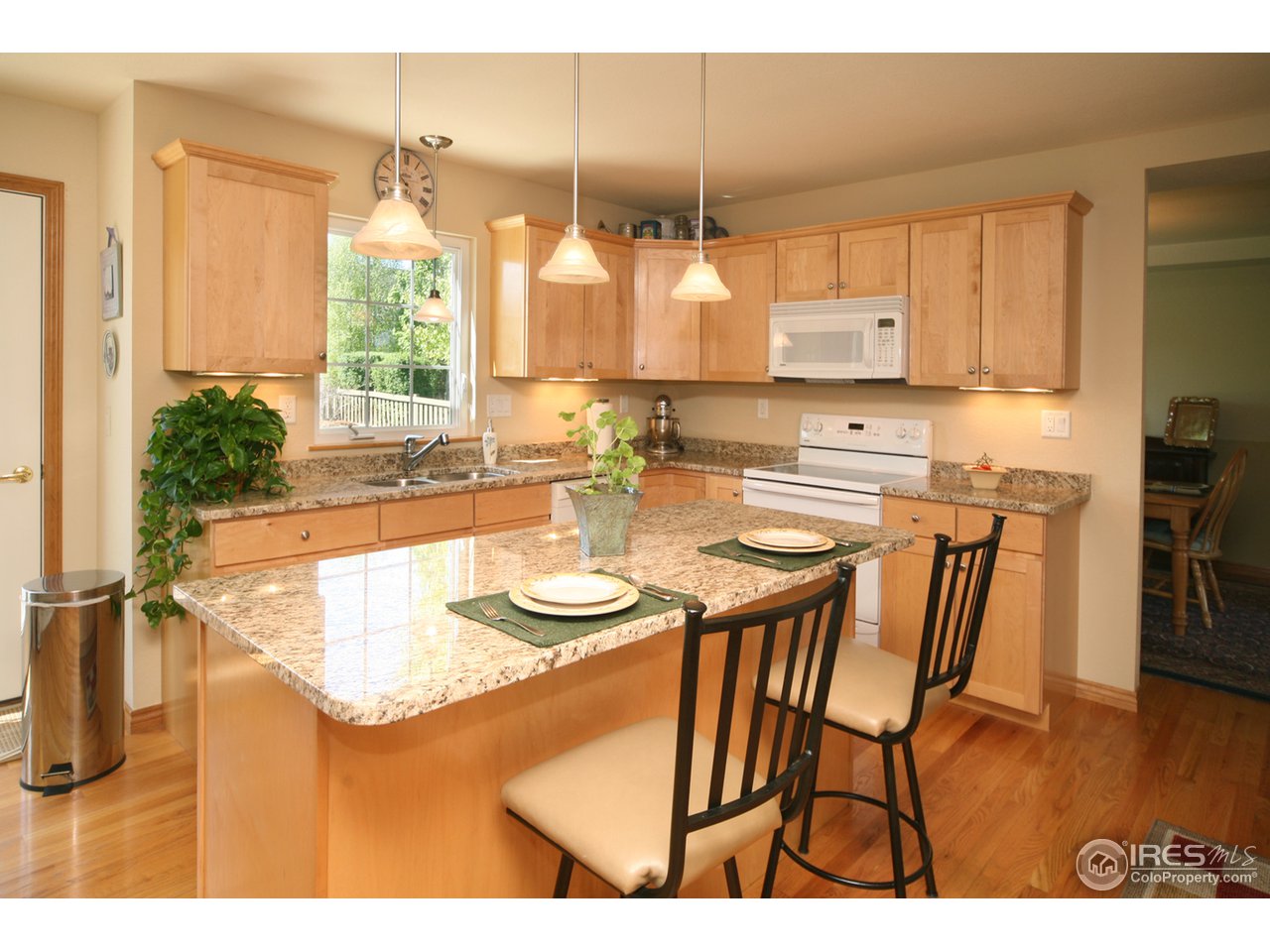 3147 Rookery Road Fort Collins, CO 80528 - Photo 4 of 18 a kitchen with furniture and window