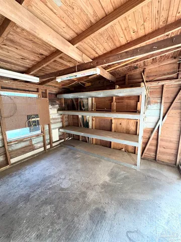 a view of an empty room with white walls