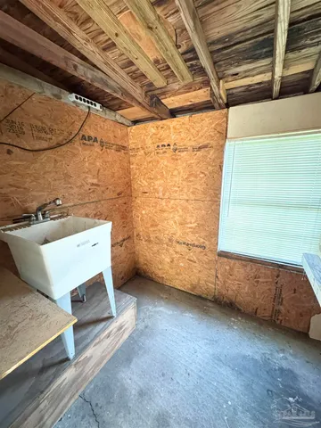 a view of room with air conditioner duct and materials on floor