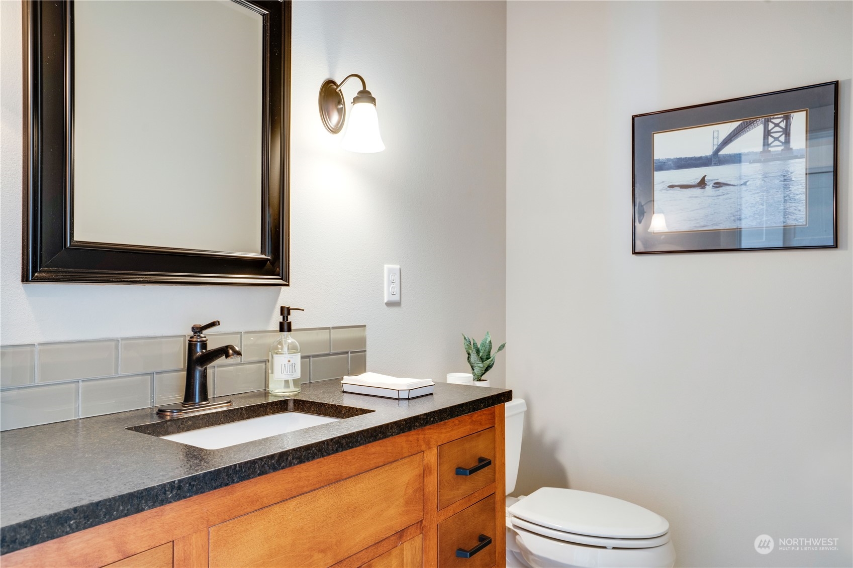 622 North Fernside Drive Tacoma, WA 98406 - Photo 26 of 40 a bathroom with a granite countertop toilet sink and mirror