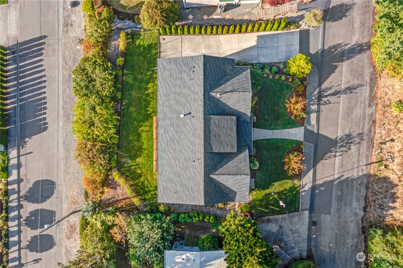 622 North Fernside Drive Tacoma, WA 98406 - Photo 38 of 40 an aerial view of multi story residential apartment building with yard and retail shops