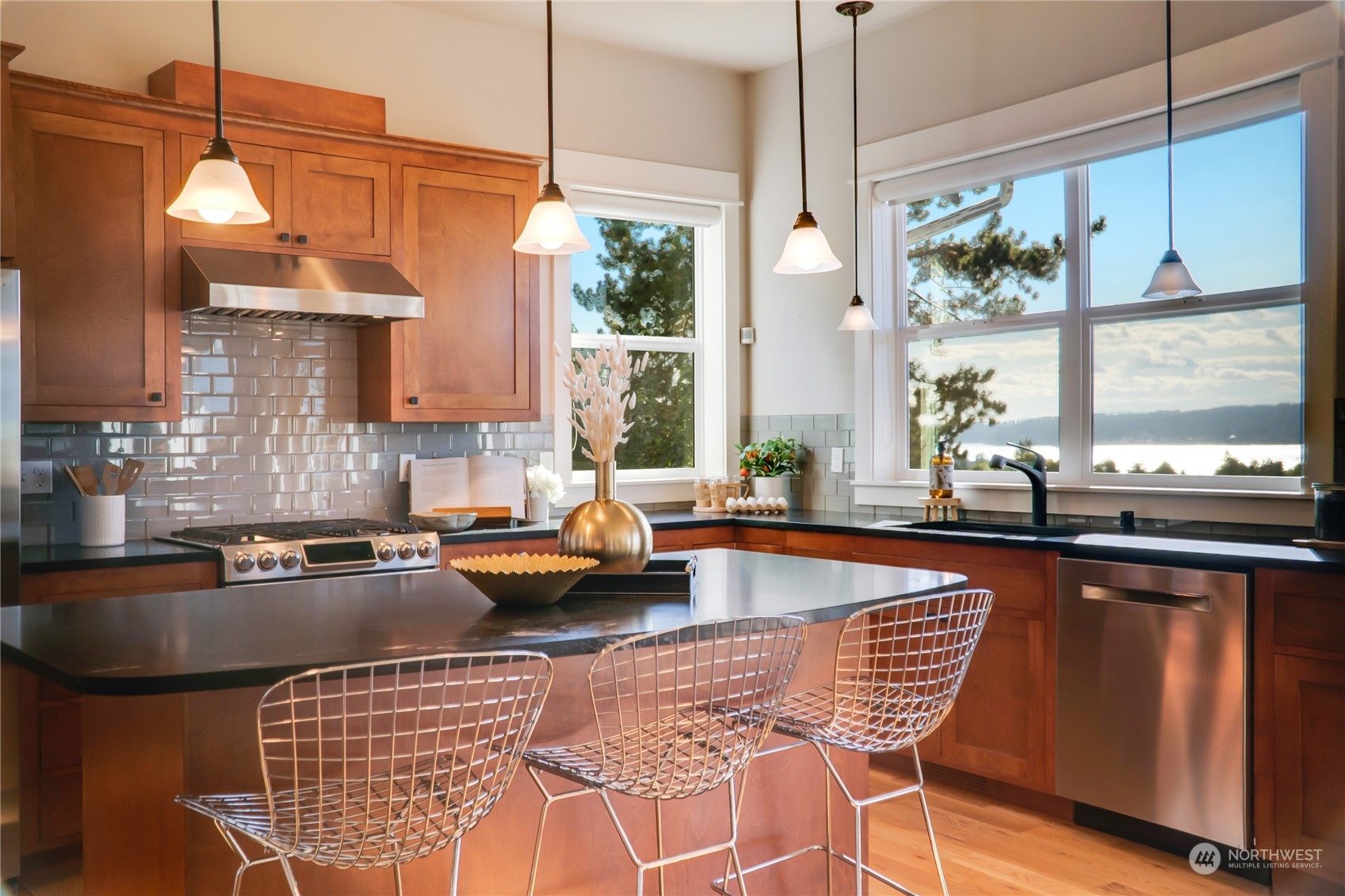 622 North Fernside Drive Tacoma, WA 98406 - Photo 8 of 40 a kitchen with stainless steel appliances granite countertop a stove a sink and chairs