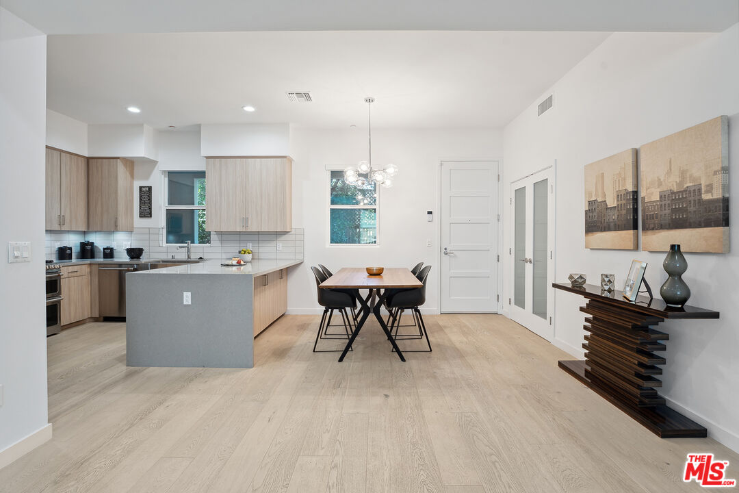 1746 Garfield Place, Unit 202 Los Angeles, CA 90028 - Photo 1 of 30 a living room with furniture and a table