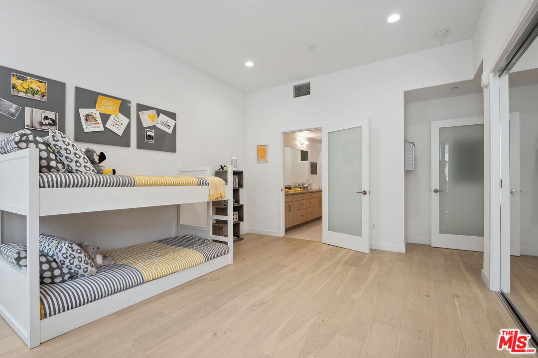 1746 Garfield Place, Unit 202 Los Angeles, CA 90028 - Photo 11 of 30 a bedroom with a bed and a couch