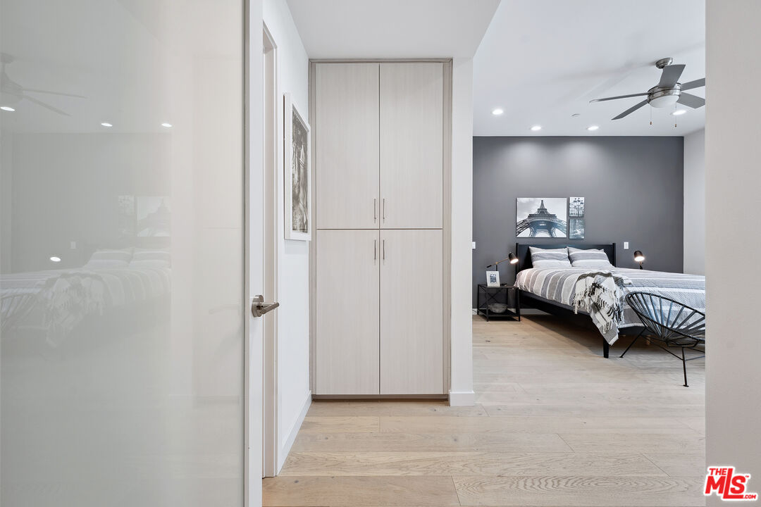 1746 Garfield Place, Unit 202 Los Angeles, CA 90028 - Photo 13 of 30 a bedroom with a bed and a lamp