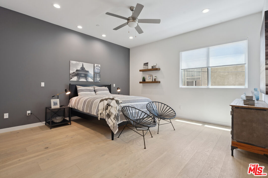 1746 Garfield Place, Unit 202 Los Angeles, CA 90028 - Photo 14 of 30 a bedroom with a bed and a couch