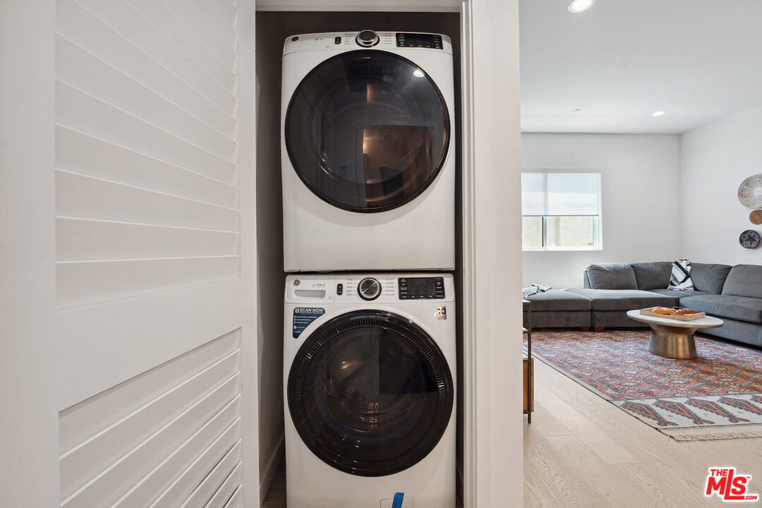 1746 Garfield Place, Unit 202 Los Angeles, CA 90028 - Photo 19 of 30 a view of a hallway with washer and dryer