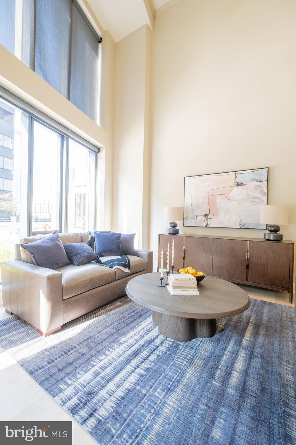2301-61 John F Kennedy Boulevard, Unit 104 Philadelphia, PA 19103 - Photo 13 of 47 a living room with furniture and a large window