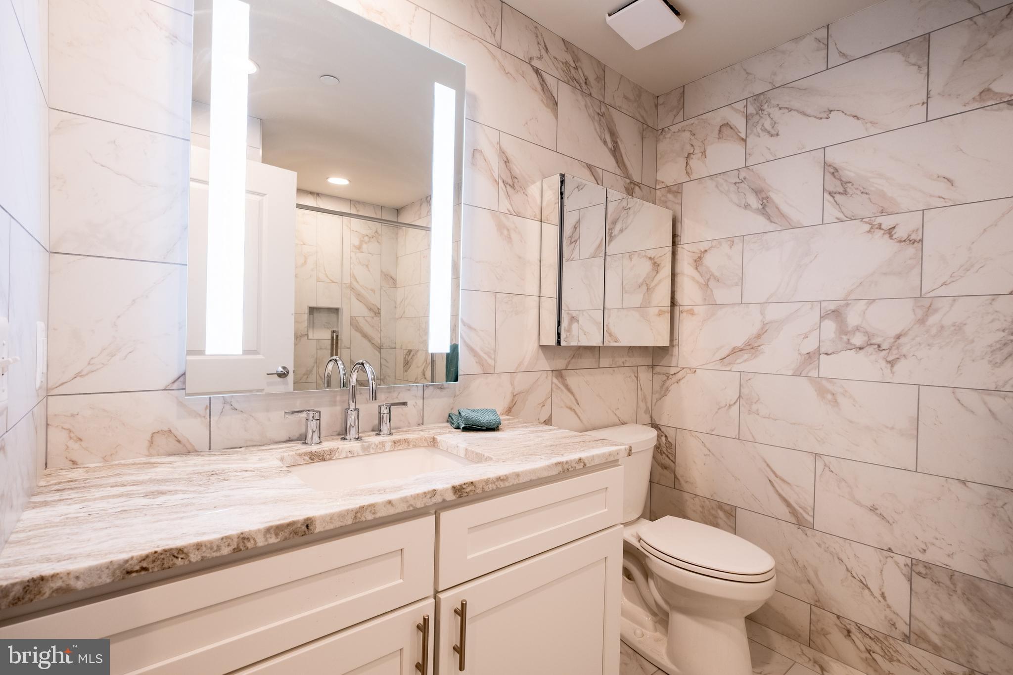 2301-61 John F Kennedy Boulevard, Unit 104 Philadelphia, PA 19103 - Photo 30 of 47 a bathroom with a sink and a toilet