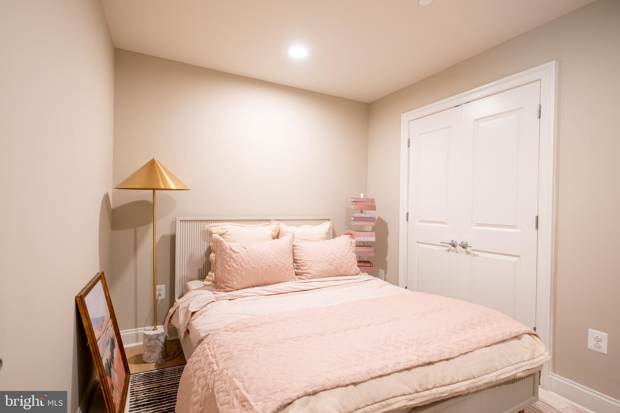 2301-61 John F Kennedy Boulevard, Unit 104 Philadelphia, PA 19103 - Photo 47 of 47 a bedroom with a bed and a lamp