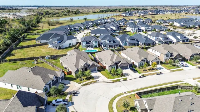 an aerial view of a house with a swimming pool