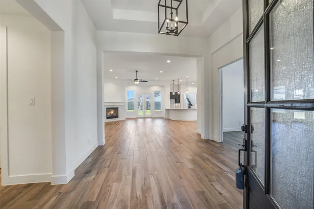 a view of a kitchen and a wooden floor
