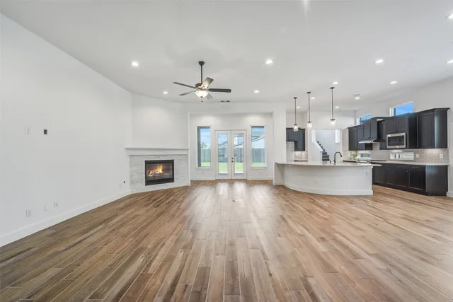a view of kitchen with cabinets and wooden floor