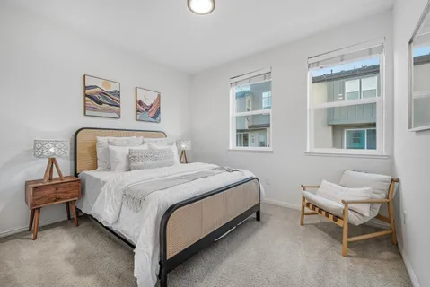 a bedroom with a bed and a view of bathroom