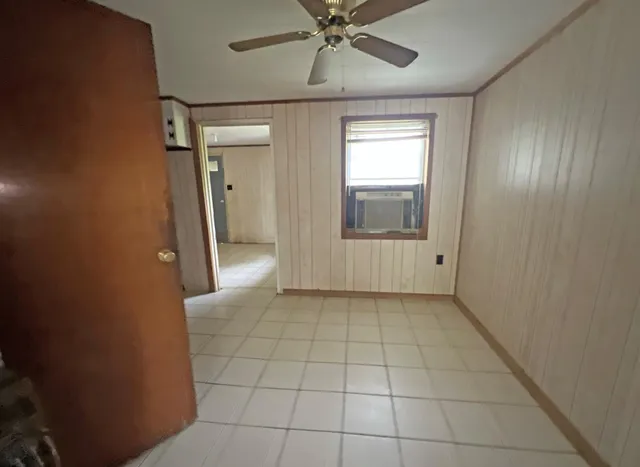 a view of an empty room and window