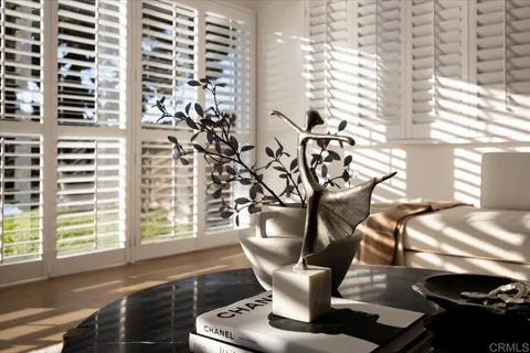 a view of a dining room with furniture and window