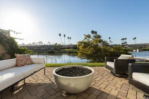 a view of a swimming pool with lawn chairs