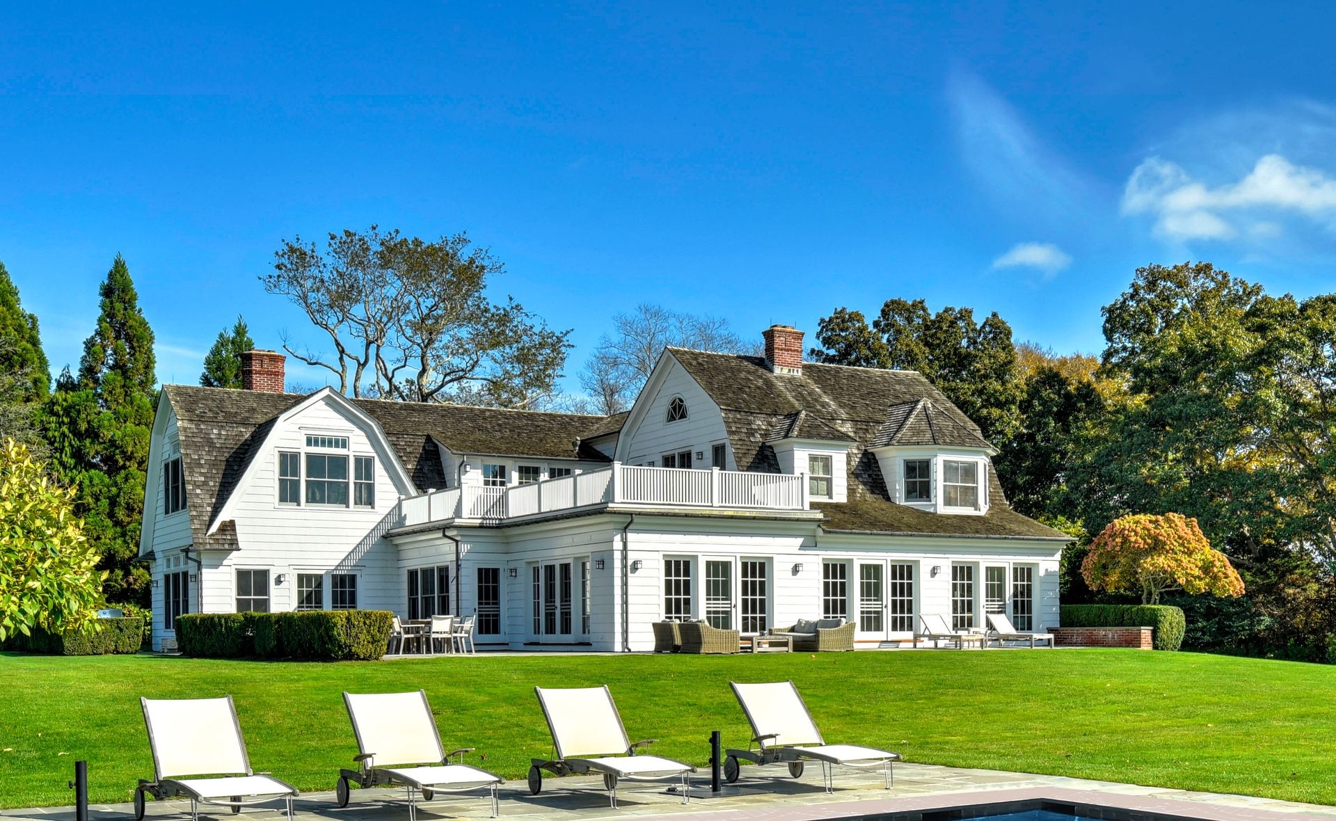 369 Town Lane Amagansett, NY 11930 - Photo 14 of 17 a front view of a house with a yard