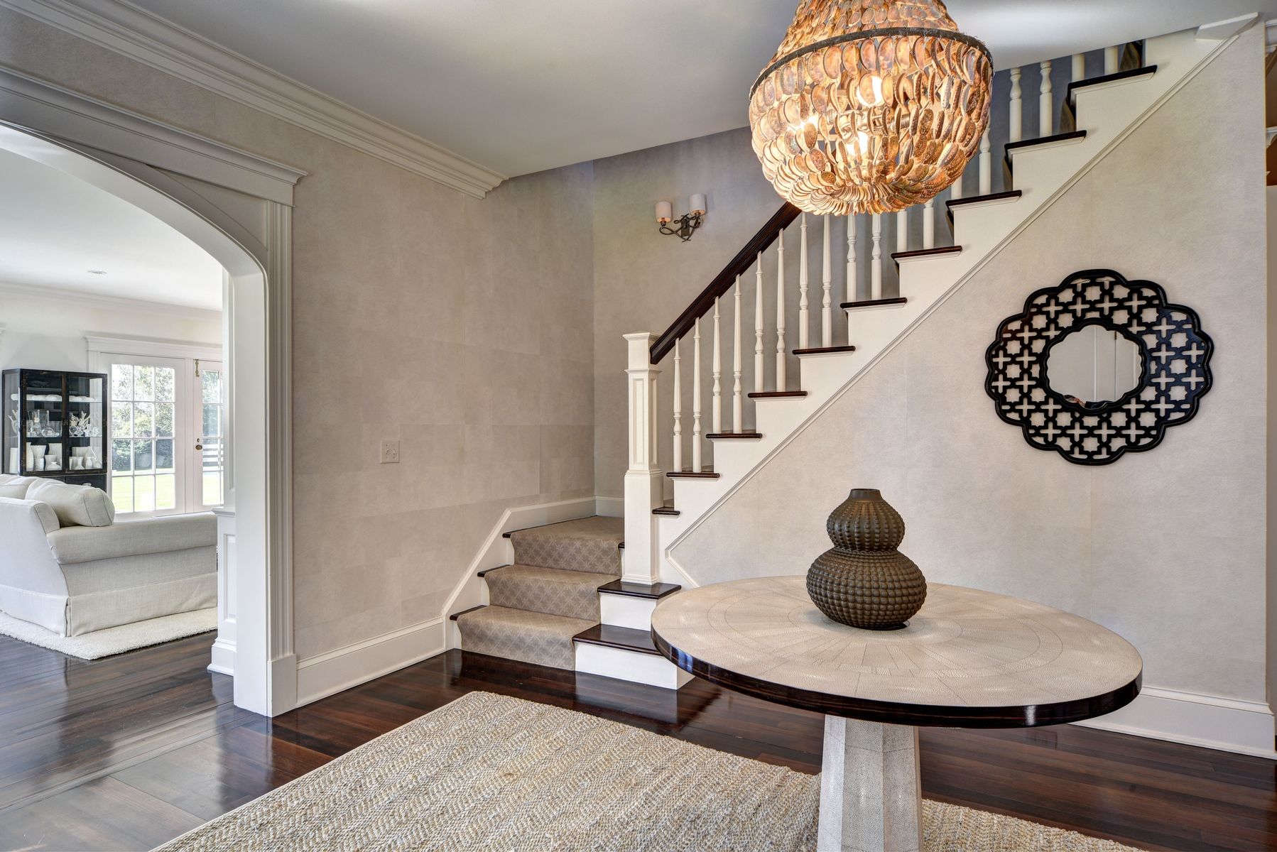 369 Town Lane Amagansett, NY 11930 - Photo 3 of 17 a view of entryway and dining room with chandelier