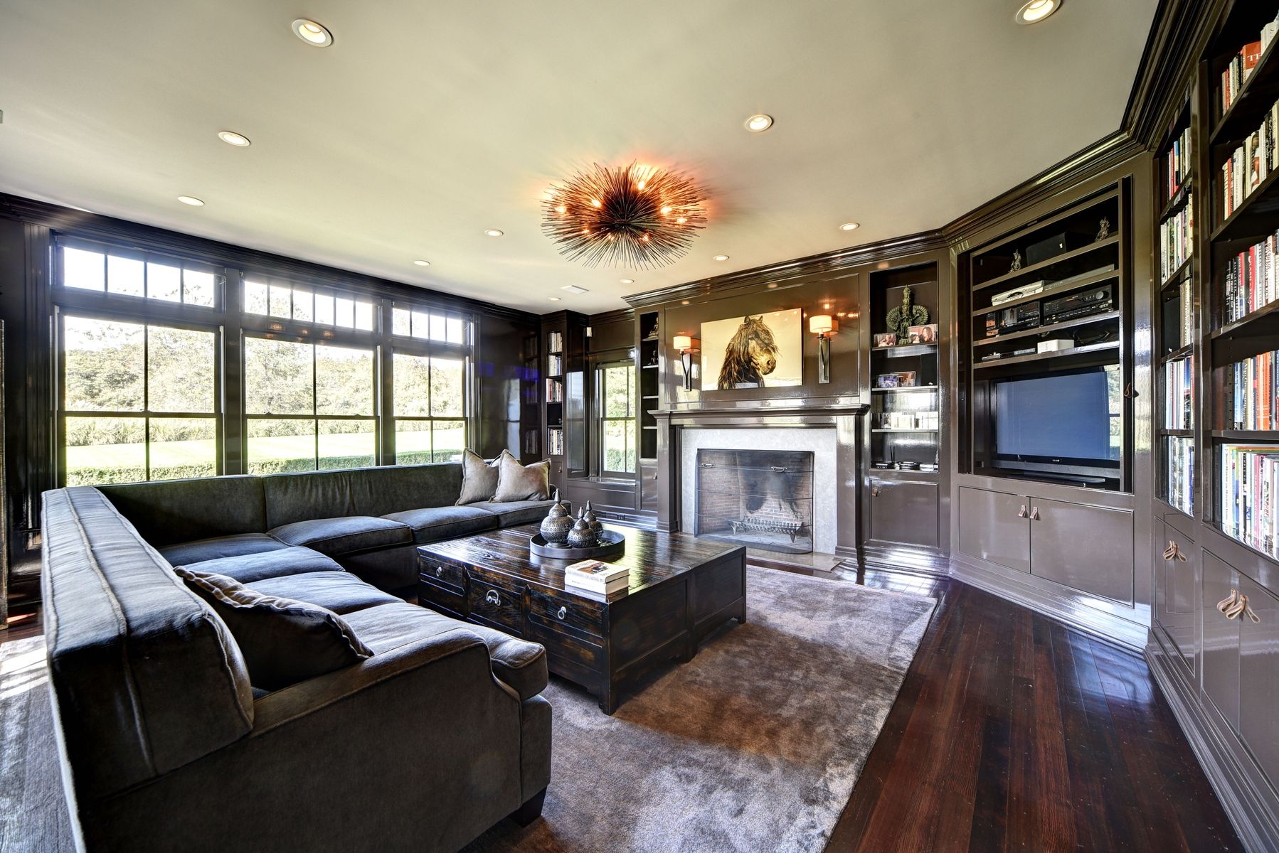 369 Town Lane Amagansett, NY 11930 - Photo 7 of 17 a living room with furniture fireplace and flat screen tv