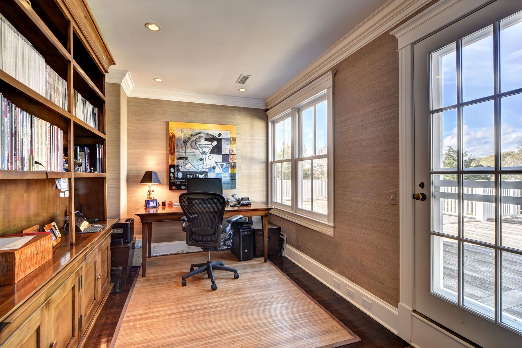 369 Town Lane Amagansett, NY 11930 - Photo 8 of 17 a work room with furniture large window and wooden floor