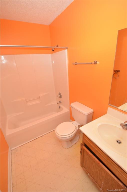 5601 Sunpath Circle Charlotte, NC 28269 - Photo 14 of 15 a bathroom with a toilet and a shower