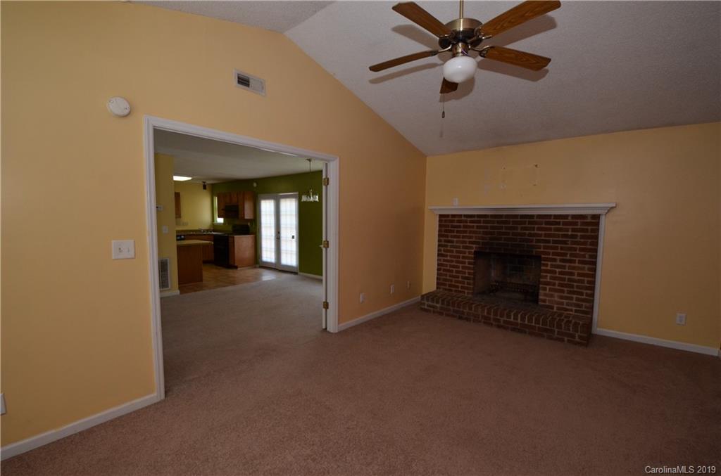 5601 Sunpath Circle Charlotte, NC 28269 - Photo 6 of 15 a view of a livingroom with a fireplace