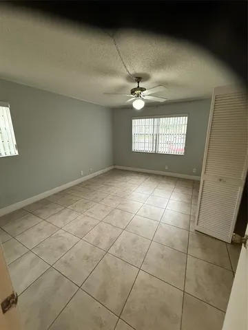 a view of an empty room and a window