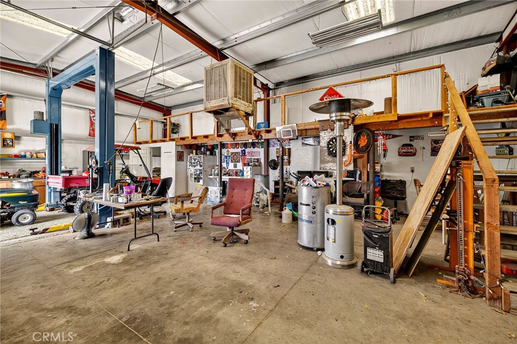 4783 County Road East Orland, CA 95963 - Photo 44 of 73 a view of a storage room with water heater and stairs
