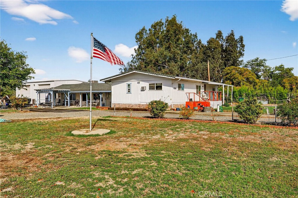 4783 County Road East Orland, CA 95963 - Photo 7 of 73 a front view of a house with garden