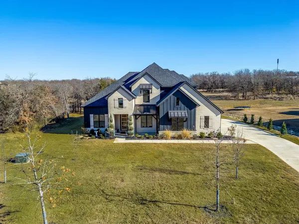 a view of a house with a big yard