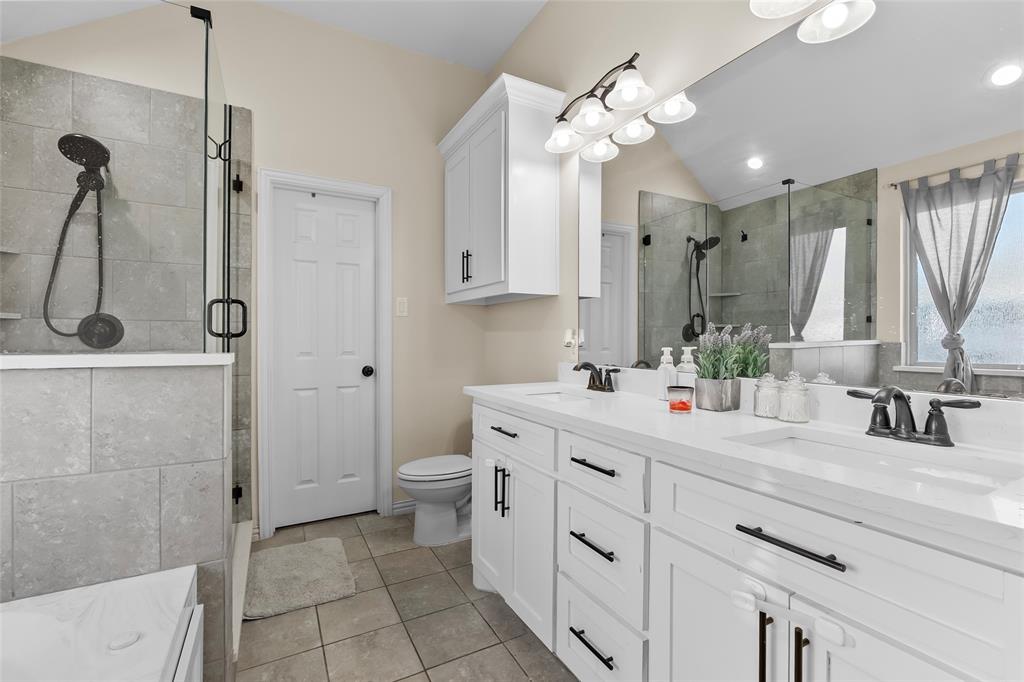 8002 County Road 1058 Rice, TX 75155 - Photo 12 of 19 a bathroom with a sink a toilet and shower