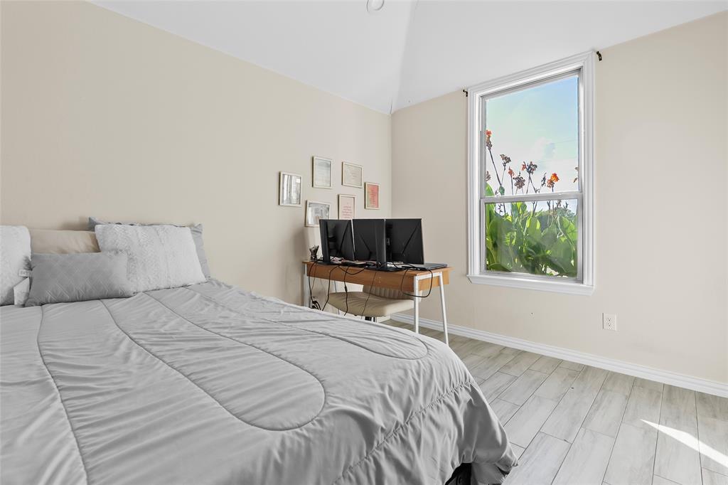 8002 County Road 1058 Rice, TX 75155 - Photo 13 of 19 a bedroom with a bed a window and a television