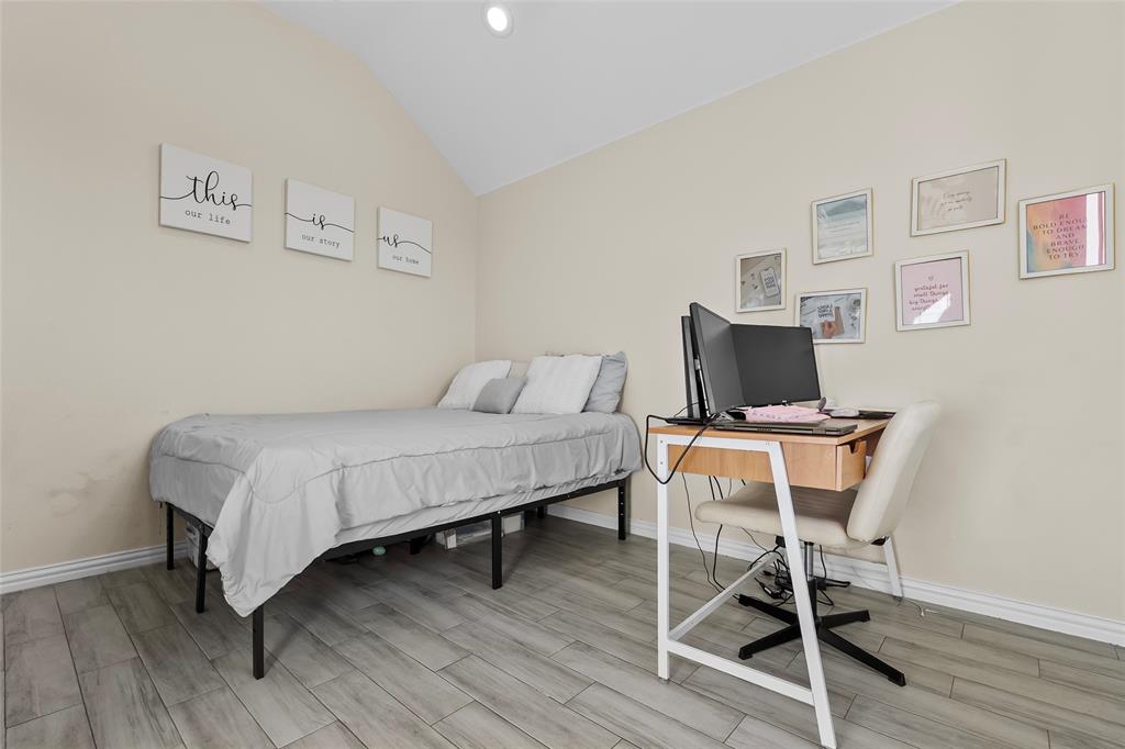 8002 County Road 1058 Rice, TX 75155 - Photo 14 of 19 a bedroom with a bed and a chair