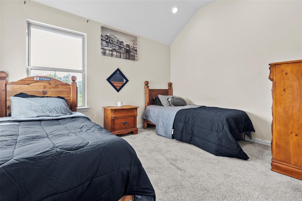 8002 County Road 1058 Rice, TX 75155 - Photo 15 of 19 a bedroom with a bed and window