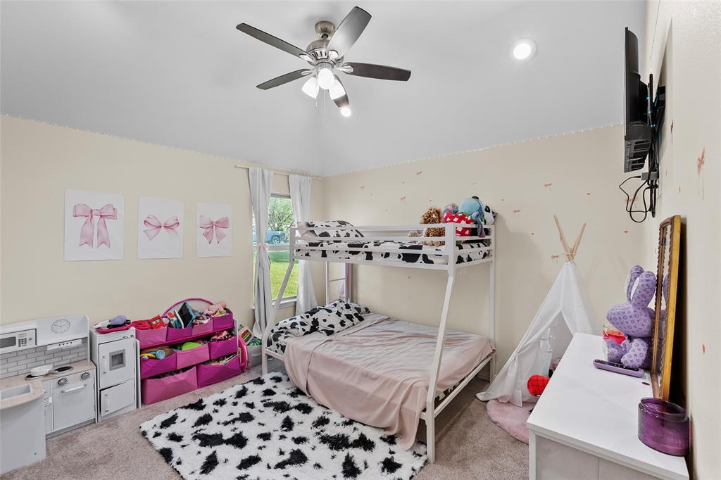 8002 County Road 1058 Rice, TX 75155 - Photo 16 of 19 a bedroom with furniture and a chandelier