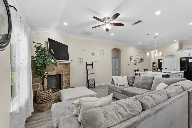 a kitchen with a dining table chairs and white cabinets