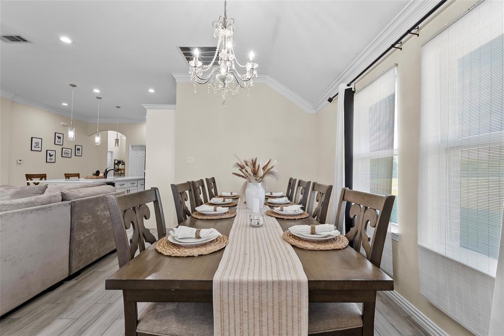 8002 County Road 1058 Rice, TX 75155 - Photo 6 of 19 a view of a dining room with furniture and wooden floor