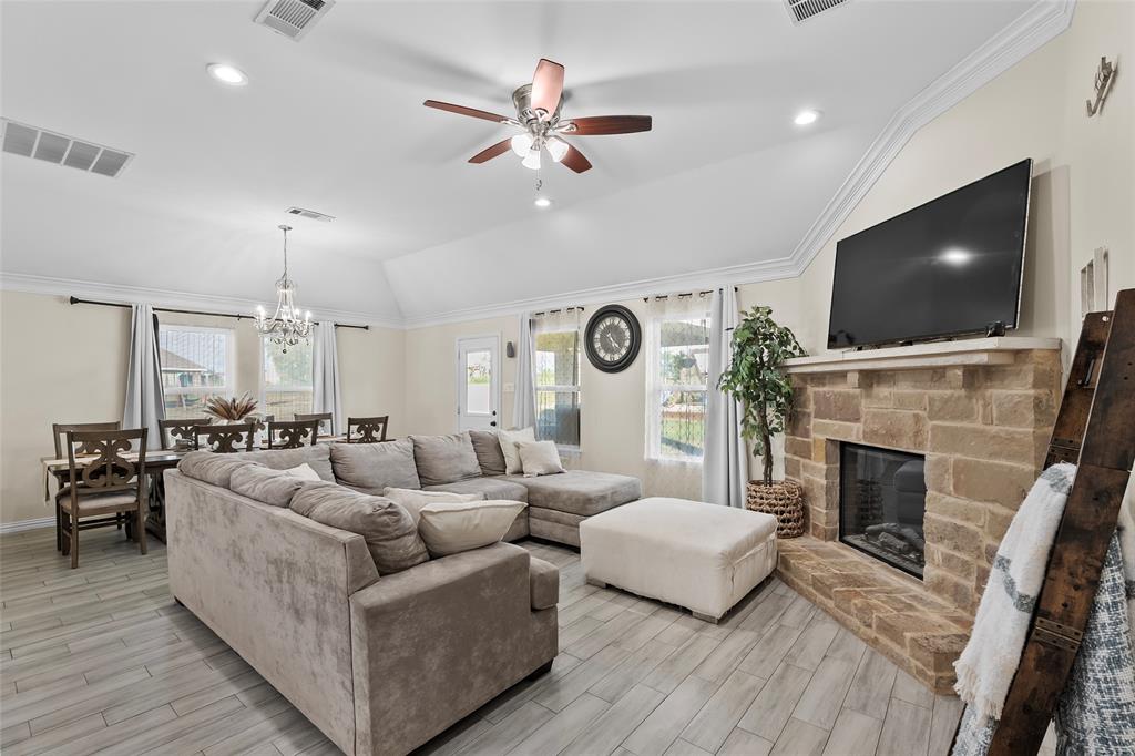 8002 County Road 1058 Rice, TX 75155 - Photo 8 of 19 a living room with fireplace furniture and a flat screen tv