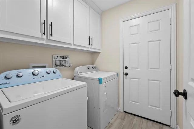 a living room with fireplace furniture and a flat screen tv