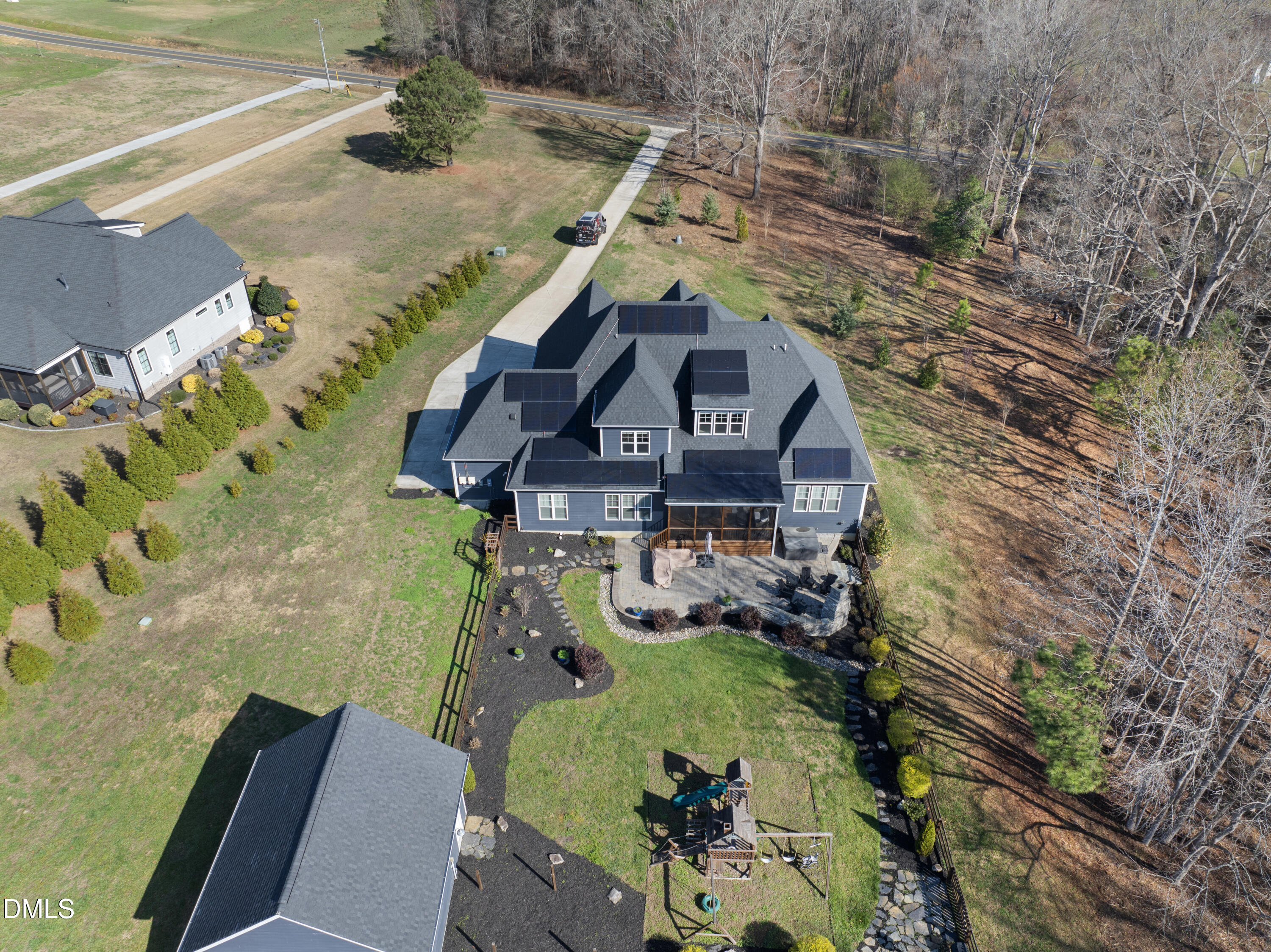 2416 Eddie Howard Road Willow Spring, NC 27592 - Photo 7 of 64 a view of roof house with outdoor seating