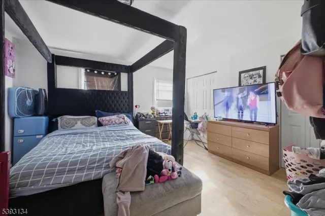 a bed room with a bed and furniture