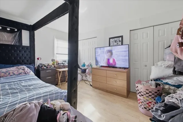 a bedroom with a bed and a cabinets