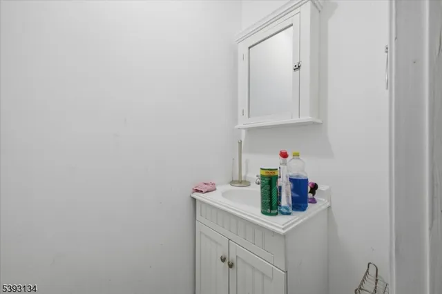 a kitchen with a refrigerator and cabinets