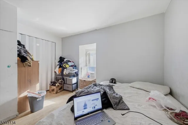 a bed room with a bed and a chandelier