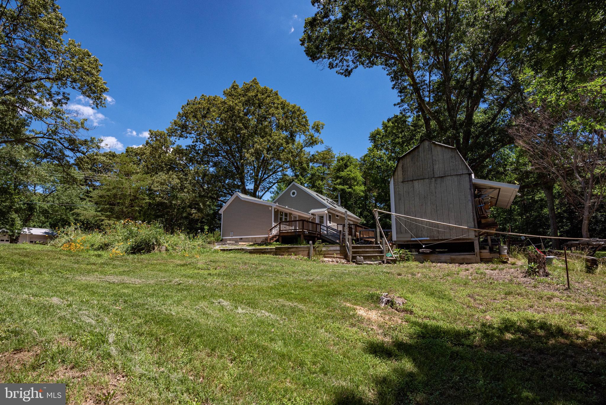 3930 Sixes Road Prince Frederick, MD 20678 - Photo 42 of 61 a backyard of a house with lots of green space