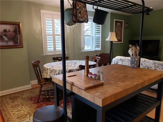 a dining room with furniture and window