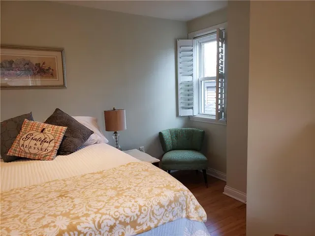 a bedroom with a bed and window